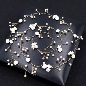 Handmade bridal hair vine with golden wire, white resin flowers, and faux pearls
