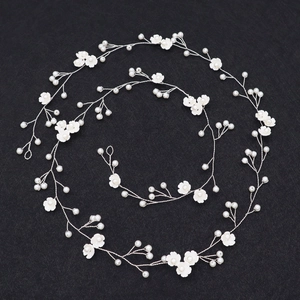 Long bridal hair vine with white flowers and pearls on silver wire for weddings