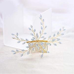 Elegant gold bridal hair comb with light blue crystals and vine wire weaving
