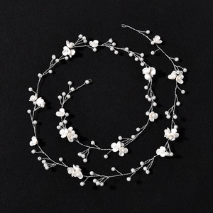 Elegant bridal hair vine with delicate white flowers and pearls on silver wire