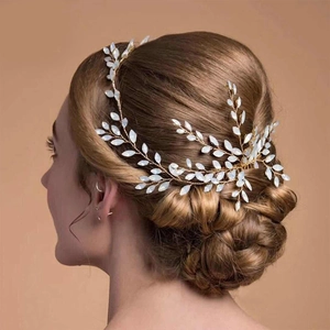 Detail showing bridal hair vine with opal marquise beads and gold wire in hair