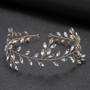 Detailed close-up of golden bridal headband with marquise crystals in leaf pattern