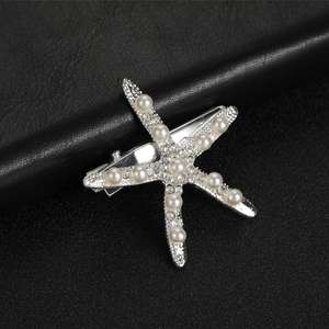 Starfish bridal hair clip with silver base, clear rhinestones and white faux pearls