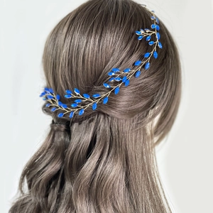 Detail view of navy blue beaded bridal headband with gold vine wiring in hair