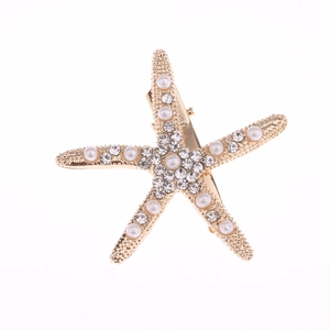 Starfish bridal hair clip with white pearls and sparkling rhinestones in gold finish