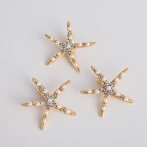 Three-piece gold starfish hair clip set with white pearls and sparkling crystals for brides