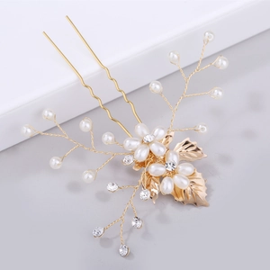 Baroque golden leaf and pearl hair pin with sparkling crystals for elegant bridal hairstyle