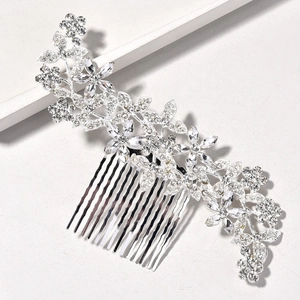 Macro detail of bridal hair comb with silver alloy leaves and sparkling crystals