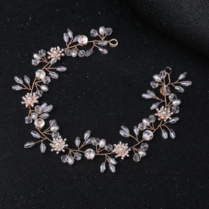 Elegant rose gold crystal headband with pearls for bridal and wedding hairstyles