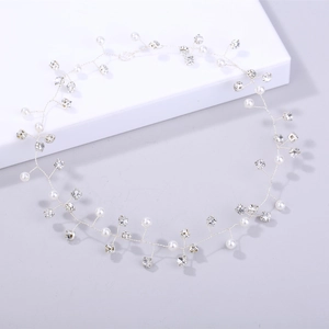 Detail of handmade silver bridal headband with pearls and sparkling rhinestones