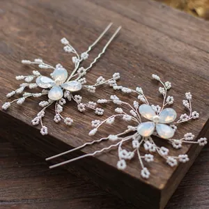 Elegant silver bridal hair pins with beaded flowers and opal stones for weddings