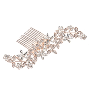 Close-up of rose gold bridal hair comb featuring intricate marquise and round rhinestones