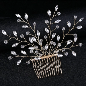 Elegant gold bridal hair comb with handcrafted crystal branches for wedding hairstyles