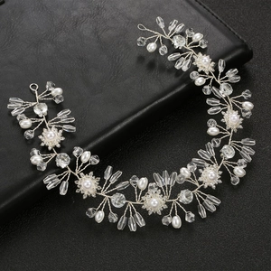 Silver bridal headband featuring pearls, clear crystals and rhinestones for weddings