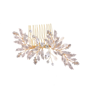 Elegant gold bridal hair comb with silver leaf accents, rhinestones and white pearls