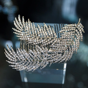 Macro shot of a pair of silver leaf bridal hair combs with sparkling rhinestones set