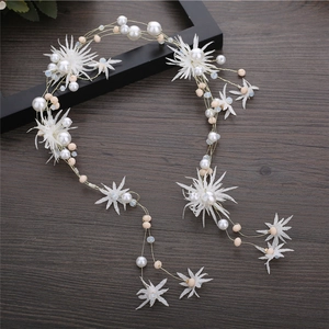 Handmade bridal hair band with white fabric flowers and pearls on gold wire