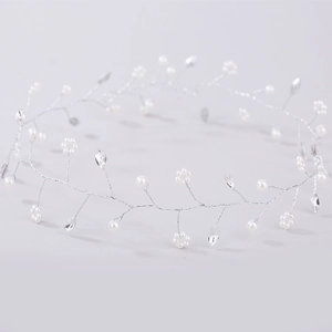 Detail of handmade bridal headband with white pearls and marquise rhinestones flowers