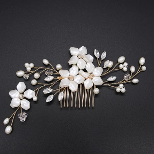 Handmade bridal hair comb with white flowers, pearls and crystals on a golden wire