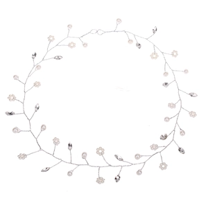 Detail of bridal hair vine with white pearls and marquise crystal leaves on silver wire