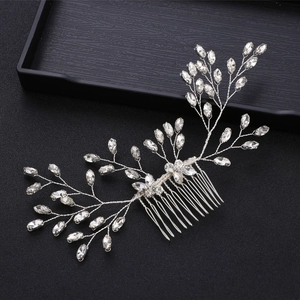 Detailed shot of silver bridal hair comb with marquise rhinestones in leaf design