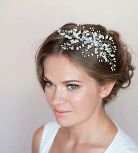 Detail of handmade pearl and crystal hair vine with silver wire for bridal hairstyles