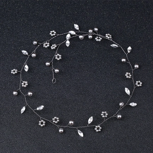 Detail of bridal hair vine with grey faux pearls and marquise crystals on silver wire