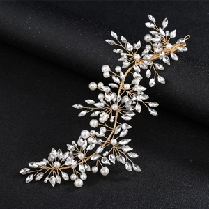 Detail of handcrafted bridal headband with gold wires, pearls and marquise crystals