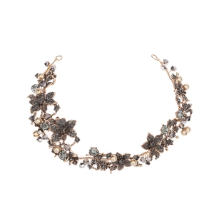 Baroque bridal headband with gray crystals and off-white pearls on a gold wire base
