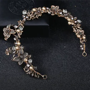 Close-up of baroque bridal headband featuring smoky grey crystals and champagne pearls