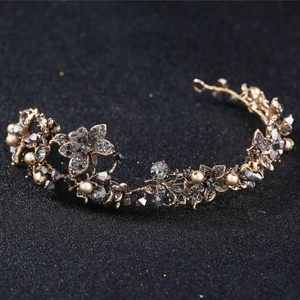 Detailed macro of vintage baroque bridal headband with black crystals and grey pearls
