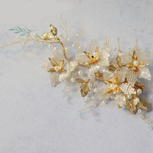 Elegant handmade bridal headpiece with gold branches, white fabric petals and pearls