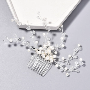 Exquisite bridal hair comb with white pearls and crystals on silver metal base