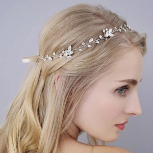 Silver bridal hair vine with sparkling crystals and white pearls on a soft floral ribbon