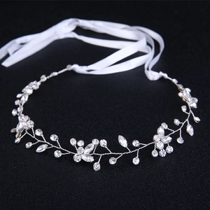 Handmade silver bridal headband with sparkling rhinestones and delicate floral patterns