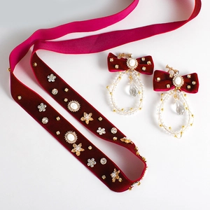 Elegant bridal jewelry set with red velvet choker and crystal drop earrings