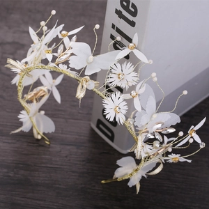 Exquisite bridal headpiece with white tulle butterflies and daisies on a gold wire band