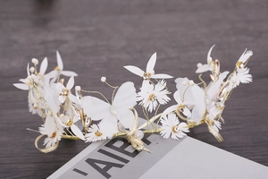 Handmade bridal headpiece with white silk flowers, butterflies and gold wire accents