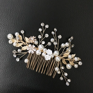 Detailed bridal hair comb with gold alloy leaves, white pearls and sparkling crystal rhinestones