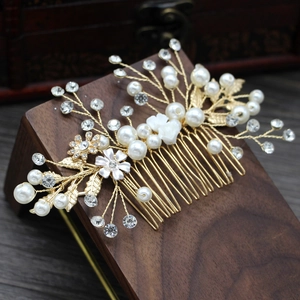 Handmade bridal hair comb with pearls, crystal rhinestones, and white flowers in gold finish