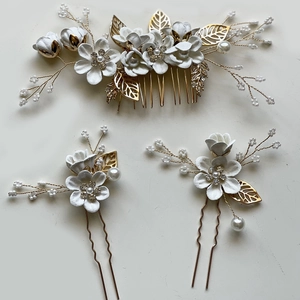 Three-piece bridal hair set with gold leaves, white pearls and floral hair comb