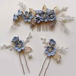 Detailed set of blue floral bridal hair comb and pins with pearls and gold leaves