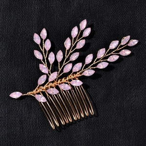Elegant gold bridal hair comb with pink crystals and handcrafted leaf-shaped metal wire