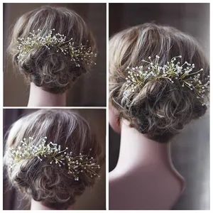 Detailed close-up of bridal U-shaped hair pin with golden wires and white crystal beads