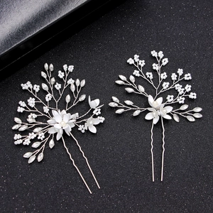 Elegant bridal hair pins with white flowers and pearls on silver u-shaped wire spikes