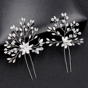 Handmade bridal hair pins with white flowers and pearls for wedding hairstyles