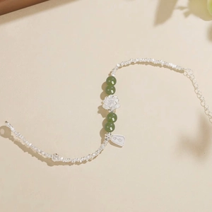 Elegant S925 sterling silver bamboo joint bracelet with green jade beads and lotus charm