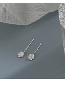 Detailed macro shot of S925 sterling silver camellia flower drop threader earrings