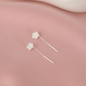 Exquisite S925 sterling silver camellia flower threader earrings on pink silk background