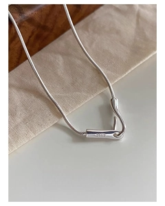 Macro shot of S925 sterling silver snake chain showing the hallmark stamp detail